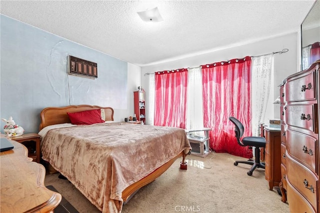 120 Alamitos Ave Unit 14, Long Beach, CA 90802 - bedroom featuring a textured ceiling, carpet, and a desk