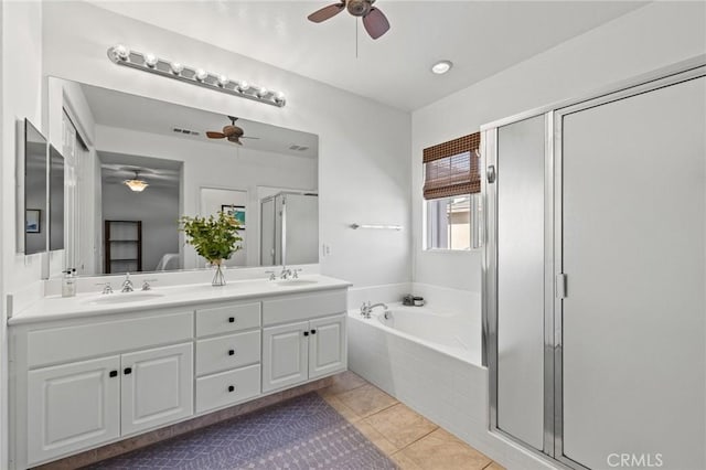 11317 Riverleaf Dr, Riverside, CA 92505 - full bath featuring ceiling fan, a shower stall, double vanity, a garden tub, and tile patterned floors