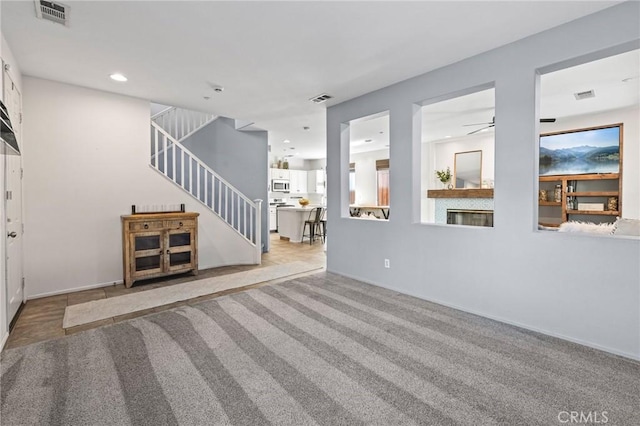 11317 Riverleaf Dr, Riverside, CA 92505 - unfurnished living room with carpet flooring, stairway, ceiling fan, and recessed lighting