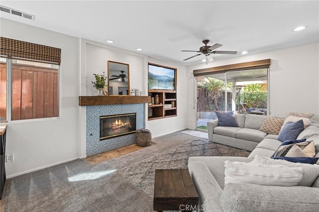 11317 Riverleaf Dr, Riverside, CA 92505 - carpeted living area featuring a ceiling fan, recessed lighting, and a fireplace