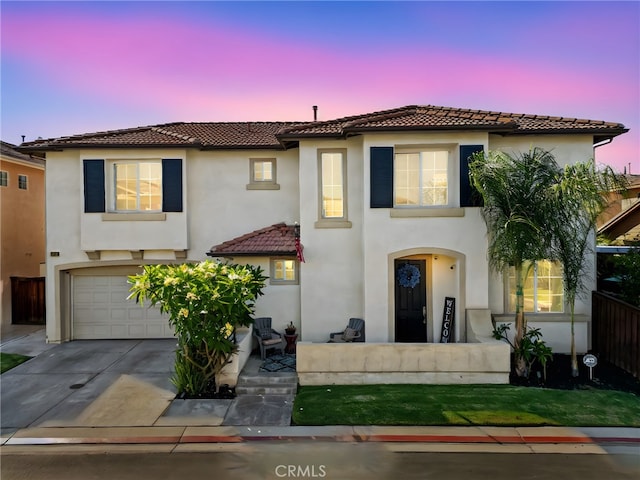 11317 Riverleaf Dr, Riverside, CA 92505 - mediterranean / spanish-style house featuring a tiled roof, stucco siding, concrete driveway, and an attached garage
