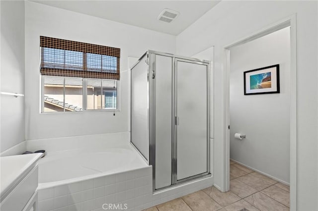 11317 Riverleaf Dr, Riverside, CA 92505 - bathroom with a stall shower, a garden tub, tile patterned floors, and vanity
