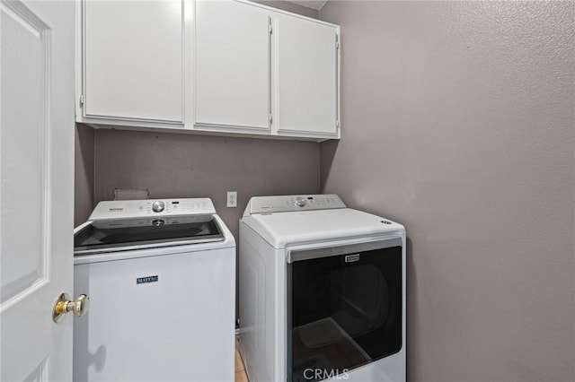 11317 Riverleaf Dr, Riverside, CA 92505 - laundry room with washing machine and clothes dryer and cabinet space