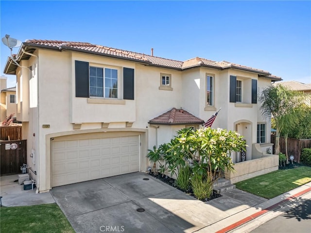 11317 Riverleaf Dr, Riverside, CA 92505 - mediterranean / spanish-style home with a tile roof, a garage, driveway, and stucco siding