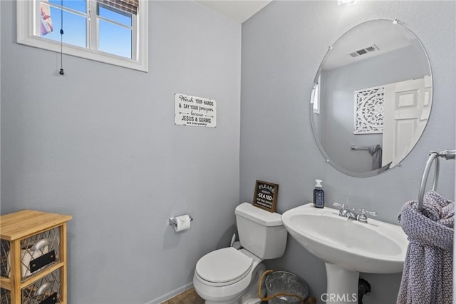 11317 Riverleaf Dr, Riverside, CA 92505 - half bathroom featuring toilet and a sink