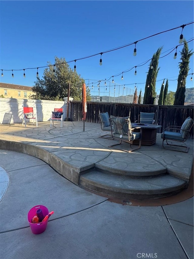 32555 Via Perales, Temecula, CA 92592 - view of patio featuring an outdoor fire pit