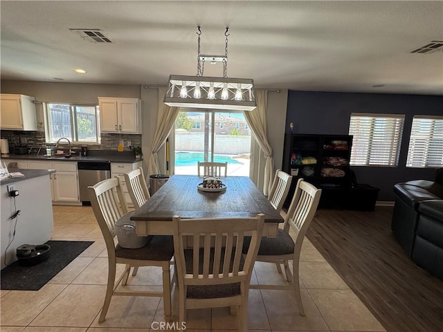 32555 Via Perales, Temecula, CA 92592 - dining room with light tile patterned floors and recessed lighting