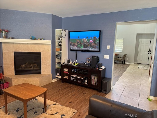 32555 Via Perales, Temecula, CA 92592 - living room featuring wood finished floors and a tile fireplace