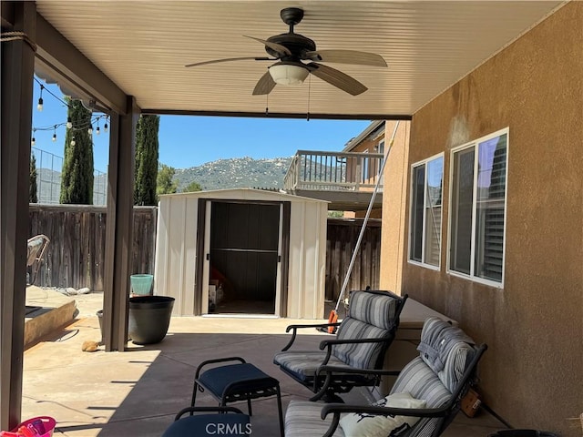 32555 Via Perales, Temecula, CA 92592 - fenced backyard with a shed, a ceiling fan, and a patio