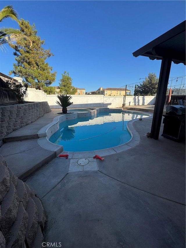 32555 Via Perales, Temecula, CA 92592 - view of pool with a fenced backyard, grilling area, a patio area, and a pool with connected hot tub