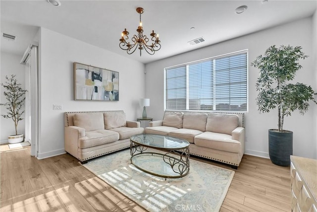 2123 Crescent Moon, Upland, CA 91786 - living room featuring a chandelier and light wood-type flooring