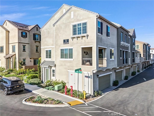 2123 Crescent Moon, Upland, CA 91786 - view of building exterior featuring an attached garage and a residential view