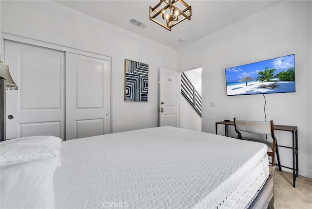 2123 Crescent Moon, Upland, CA 91786 - bedroom featuring a closet, light carpet, and a chandelier