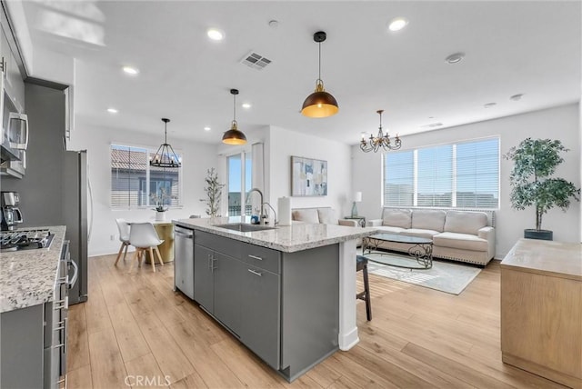 2123 Crescent Moon, Upland, CA 91786 - kitchen with a chandelier, gray cabinets, a kitchen island with sink, appliances with stainless steel finishes, and recessed lighting