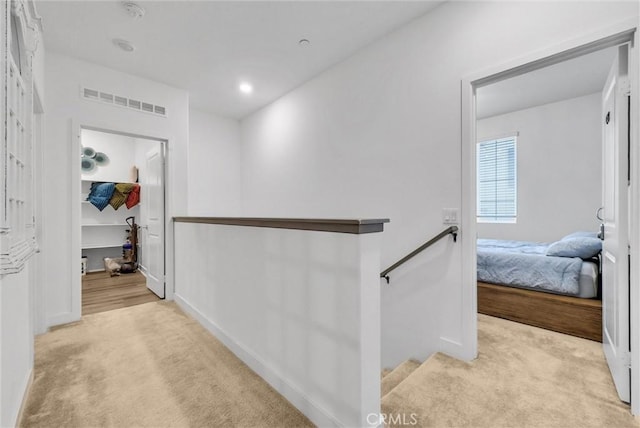 2123 Crescent Moon, Upland, CA 91786 - corridor featuring light carpet and an upstairs landing