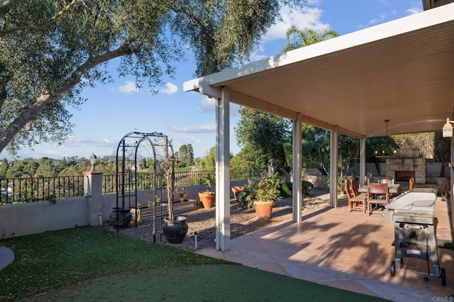 11052 Madrigal St, San Diego, CA 92129 - view of patio / terrace with an outdoor stone fireplace and area for grilling