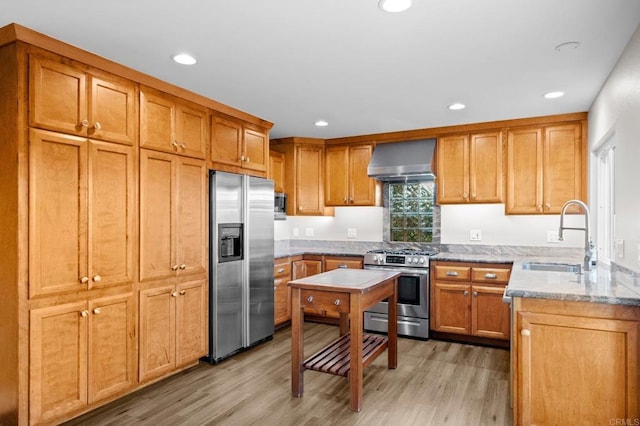 11052 Madrigal St, San Diego, CA 92129 - kitchen featuring appliances with stainless steel finishes, wall chimney range hood, light wood-type flooring, light stone counters, and recessed lighting