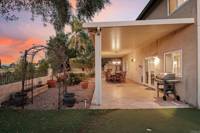 11052 Madrigal St, San Diego, CA 92129 - patio terrace at dusk with a grill, a patio, and outdoor dining space