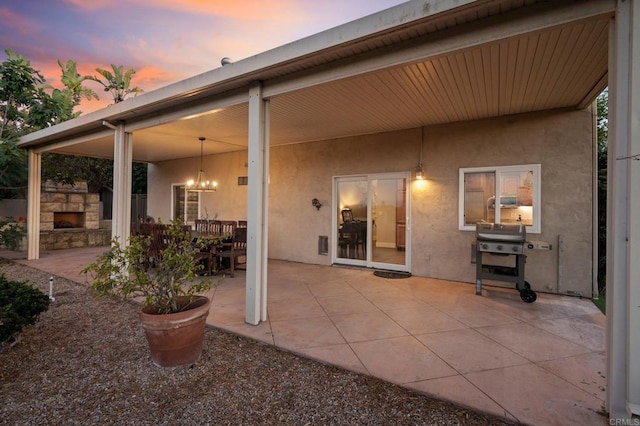 11052 Madrigal St, San Diego, CA 92129 - view of patio / terrace featuring an outdoor stone fireplace and area for grilling