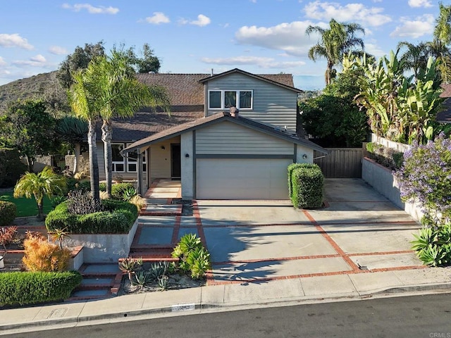 11052 Madrigal St, San Diego, CA 92129 - view of front facade with concrete driveway and a garage