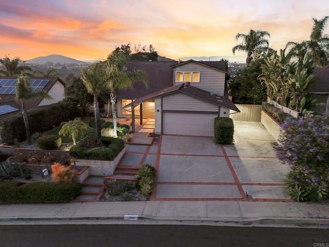 11052 Madrigal St, San Diego, CA 92129 - view of front of home featuring driveway, a mountain view, and stairway