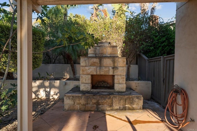 11052 Madrigal St, San Diego, CA 92129 - view of patio / terrace with an outdoor stone fireplace