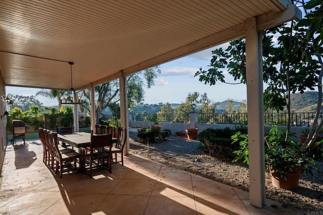 11052 Madrigal St, San Diego, CA 92129 - fenced backyard featuring a patio area, outdoor dining area, and a mountain view