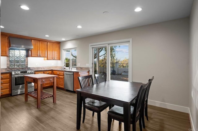 11052 Madrigal St, San Diego, CA 92129 - dining space featuring wood finished floors and recessed lighting