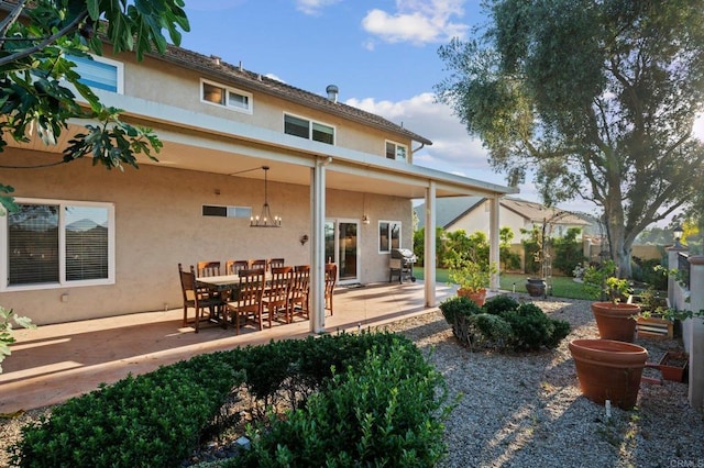 11052 Madrigal St, San Diego, CA 92129 - back of house featuring stucco siding and a patio area