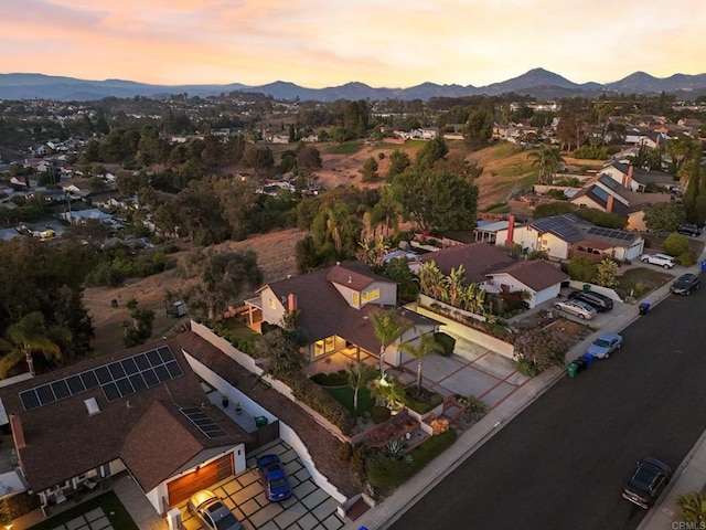 11052 Madrigal St, San Diego, CA 92129 - aerial overview of property's location with a mountain backdrop and nearby suburban area