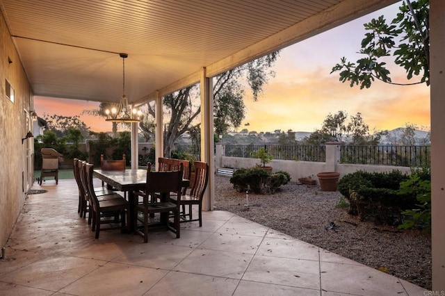 11052 Madrigal St, San Diego, CA 92129 - patio terrace at dusk featuring a patio and outdoor dining area