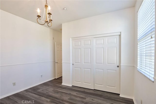 44939 Bellflower Ln Unit 118, Temecula, CA 92592 - unfurnished bedroom featuring a chandelier, multiple windows, and dark wood-type flooring