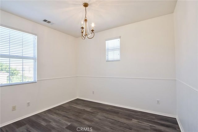 44939 Bellflower Ln Unit 118, Temecula, CA 92592 - empty room featuring healthy amount of natural light, a chandelier, and dark wood-style floors