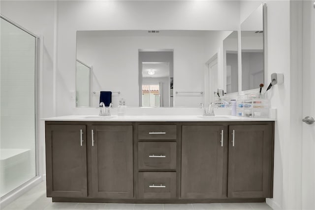 26149 Park Ave Unit 38, Loma Linda, CA 92354 - bathroom with double vanity, an enclosed shower, and tile patterned floors