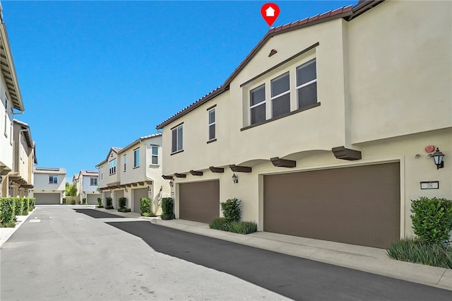 26149 Park Ave Unit 38, Loma Linda, CA 92354 - view of asphalt road featuring a residential view