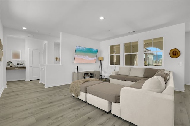 26149 Park Ave Unit 38, Loma Linda, CA 92354 - living room with light wood-style flooring and recessed lighting
