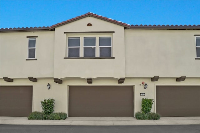 26149 Park Ave Unit 38, Loma Linda, CA 92354 - view of front of property with stucco siding and an attached garage