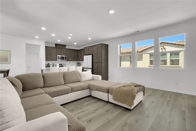 26149 Park Ave Unit 38, Loma Linda, CA 92354 - living room featuring recessed lighting and light wood-type flooring