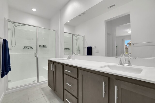 26149 Park Ave Unit 38, Loma Linda, CA 92354 - bathroom with tile patterned flooring, a stall shower, and double vanity
