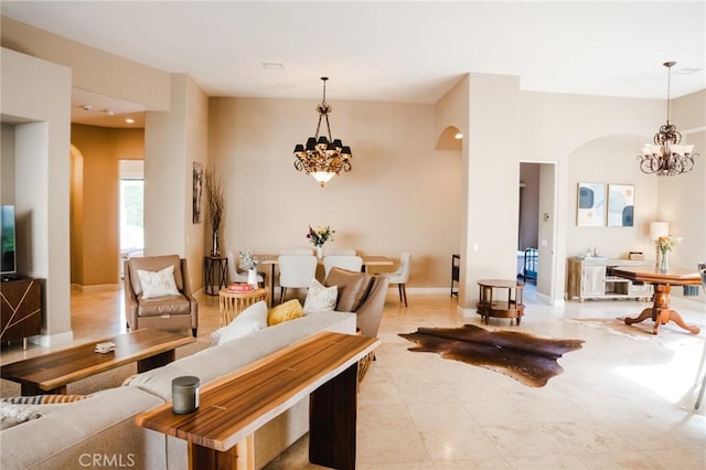 46614 Bradshaw Trl, La Quinta, CA 92253 - living room with arched walkways, a chandelier, and recessed lighting