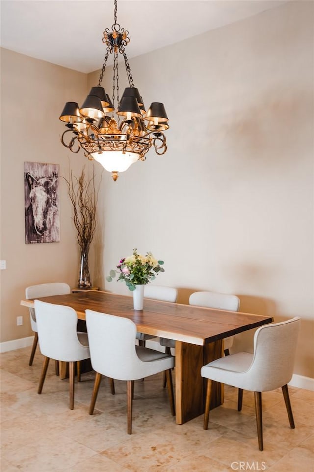 46614 Bradshaw Trl, La Quinta, CA 92253 - dining room featuring a chandelier and baseboards