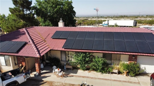 2390 Trinity Rd, Pinon Hills, CA 92372 - view of front of property with roof mounted solar panels, a chimney, and a tiled roof
