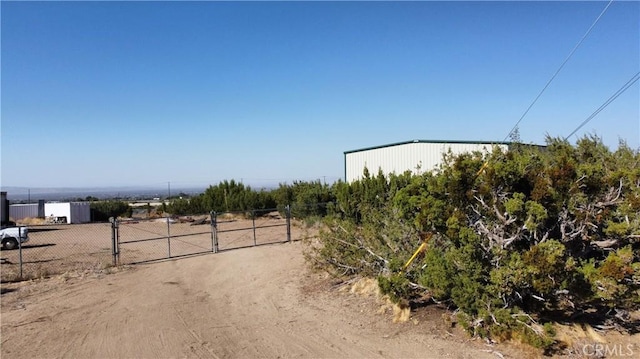2390 Trinity Rd, Pinon Hills, CA 92372 - view of road with a gate and a view of countryside