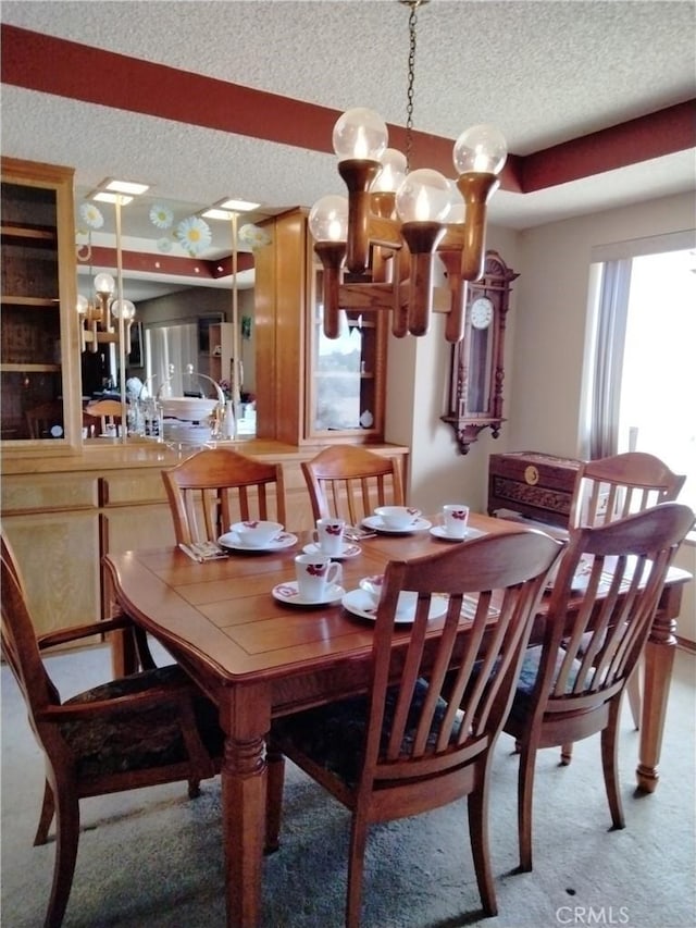 2390 Trinity Rd, Pinon Hills, CA 92372 - carpeted dining area with a textured ceiling and a chandelier