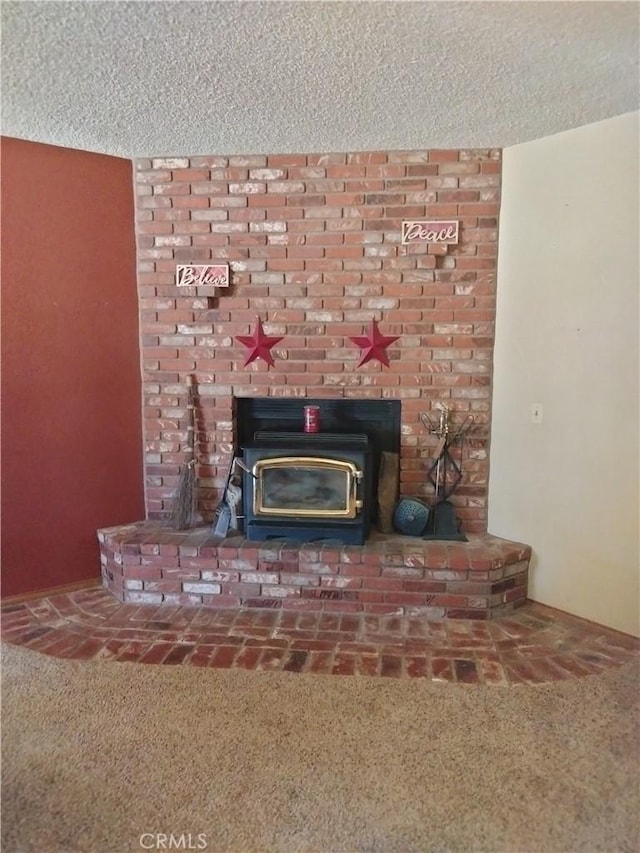 2390 Trinity Rd, Pinon Hills, CA 92372 - detailed view of a wood stove, carpet, and a textured ceiling