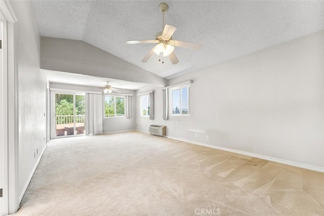 19080 Shakespeare Dr, Walnut, CA 91789 - spare room featuring ceiling fan, a wall mounted AC, light carpet, a textured ceiling, and vaulted ceiling