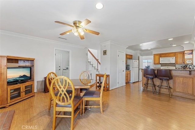 19080 Shakespeare Dr, Walnut, CA 91789 - dining room with light wood-style flooring, crown molding, ceiling fan, stairs, and recessed lighting
