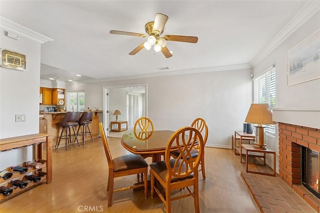 19080 Shakespeare Dr, Walnut, CA 91789 - dining area featuring ornamental molding, a fireplace, ceiling fan, light wood-style floors, and recessed lighting