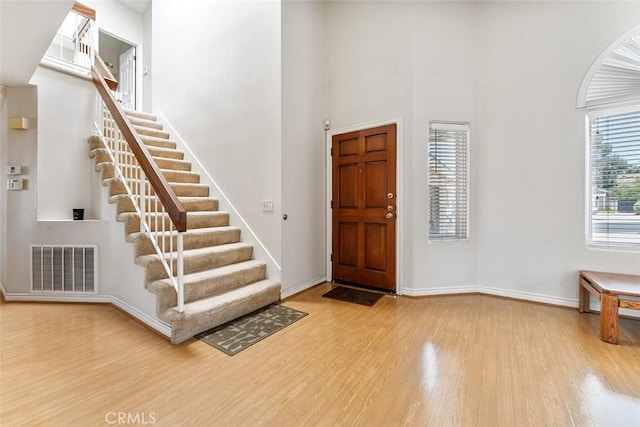 19080 Shakespeare Dr, Walnut, CA 91789 - entryway with wood finished floors, stairs, and a high ceiling