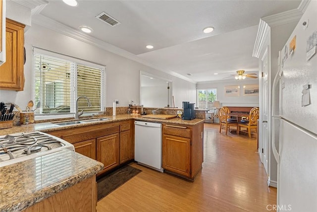 19080 Shakespeare Dr, Walnut, CA 91789 - kitchen featuring white appliances, brown cabinets, light wood-style floors, a peninsula, and recessed lighting